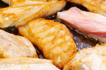Meat close up deep fried professional kitchen. The process of flying meat. close-up