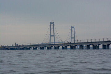 Big Belt bridge in denmark on a cloudy grey day.