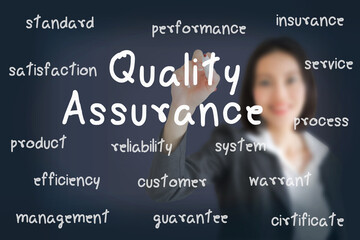 businesswoman writing  quality assurance concept