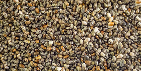 Chia seeds close-up background macro. The texture of the Chia seeds. Healthy food. banner