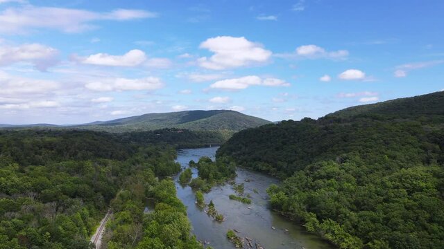 Flying over (aerial top view) West Virginia forests, Mountains and Potomac River on Blue sky background. 
