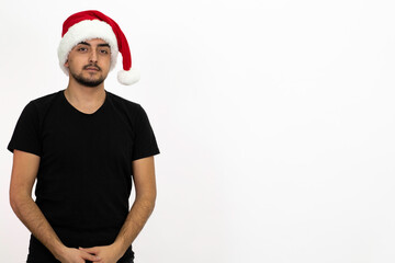 Young man wearing a Santa hat. He is wearing a black shirt. Isolated image white background.