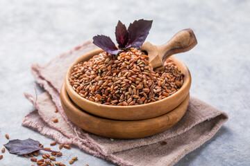 Brown Unpolished rice in wooden bowl. Long grain rice background.