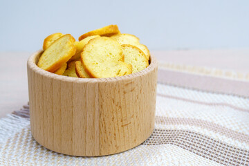 homemade croutons from white bread in wood bowl. copyspace