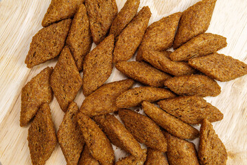 Croutons brown background, texture from pieces of dried bread. Top view