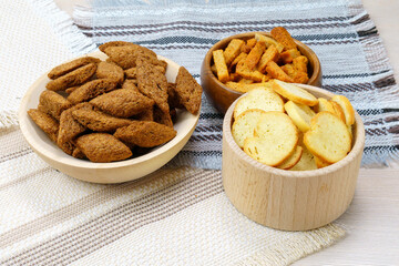 fried croutons close-up three types of crackers white, black, brown.