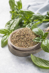 greens, culinary and flavoring concept - bunch of fresh basil herb and dry