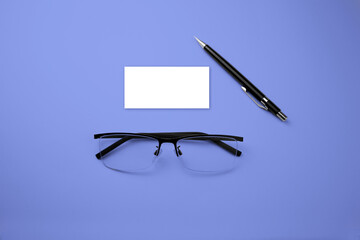 glasses and pen on the table