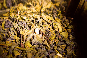 dried green tea leaves on the table