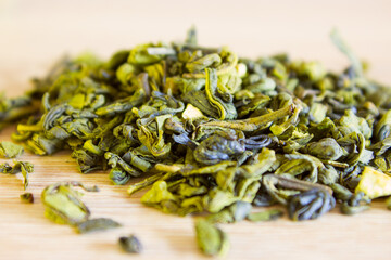 dried green tea leaves on the table