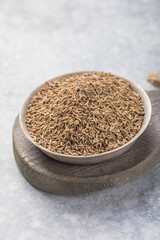 Cumin or caraway seeds on white background. Top view