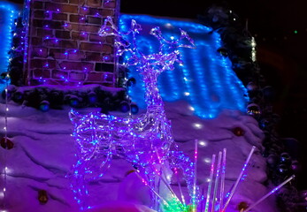 Christmas decoration of the roof of the hut at night