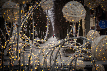 Christmas decoration made out of a fountain in a city center and alley behind it