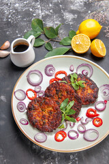 top view delicious cutlets with onion rings on grey background meat meal dish cuisine