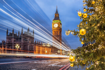 Big Ben with Christmas tree on bridge in the evening, London, England, United Kingdom