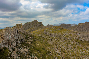 Colorful mountain landscape with lovely clouds. Highland region of Majorca island, Spain.