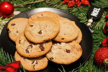Chocolate chip cookies with a Christmas theme. Chocolate chip cookie on blake plate
