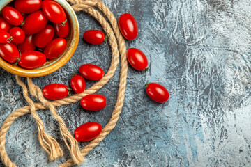 top view red cherry tomatoes with ropes on light background photo color salad