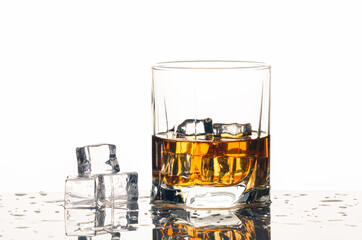Single malt whiskey with ice isolated on white
