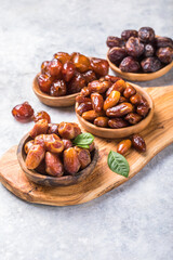 Dates or dattes palm fruit in wooden bowl is snack healthy.Creative layout made of dried dates. Flat lay. Food concept. Fruits dates. Dates Palm fruit isolated on white. Dried fruits. Healthy diet.