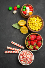 top view fresh fruits with candies on dark background photo fruit color