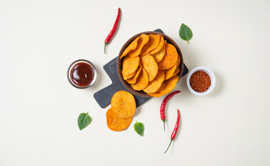  Mexican  nachos  with chili pepper,  spice and barbecue dip on yellow background