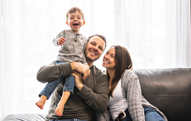 happy family mother and father having fun with child son at home