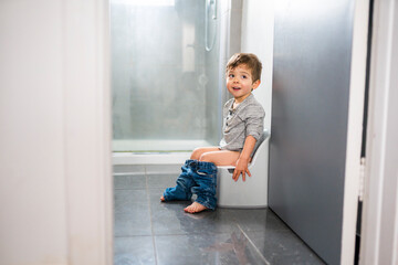 two year old boy on chamber pot, successfull hygiene