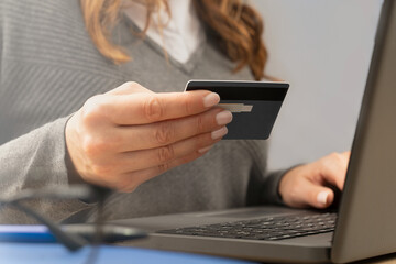 Payment by card for online purchases.Close up stock photo.