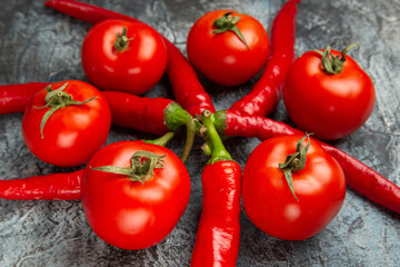 front view fresh tomatoes with spicy peppers on dark background health red ripe food