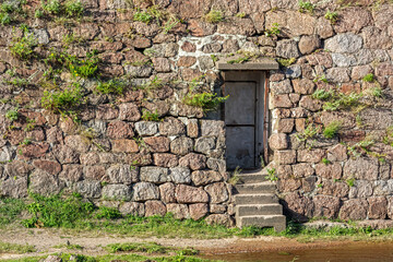 Fototapeta na wymiar Door in a stone wall.