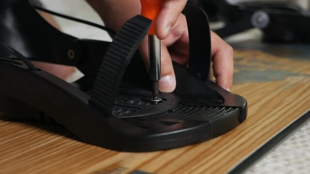 The process of attaching bindings to your snowboard at home. Prepares the snowboard for the winter trip