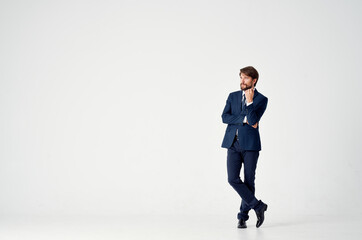 Fototapeta na wymiar confident businessman in a classic suit on a light background Copy Space
