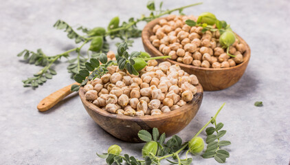 Dry chickpeas or garbanzo beans in wooden  bowl, healthy food ingredient