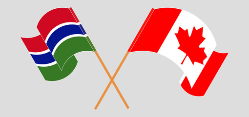 Crossed and waving flags of the Gambia and Canada
