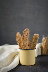 Almond biscotti or cantucci in an enamel cup