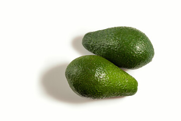 Two ripe fresh avocados