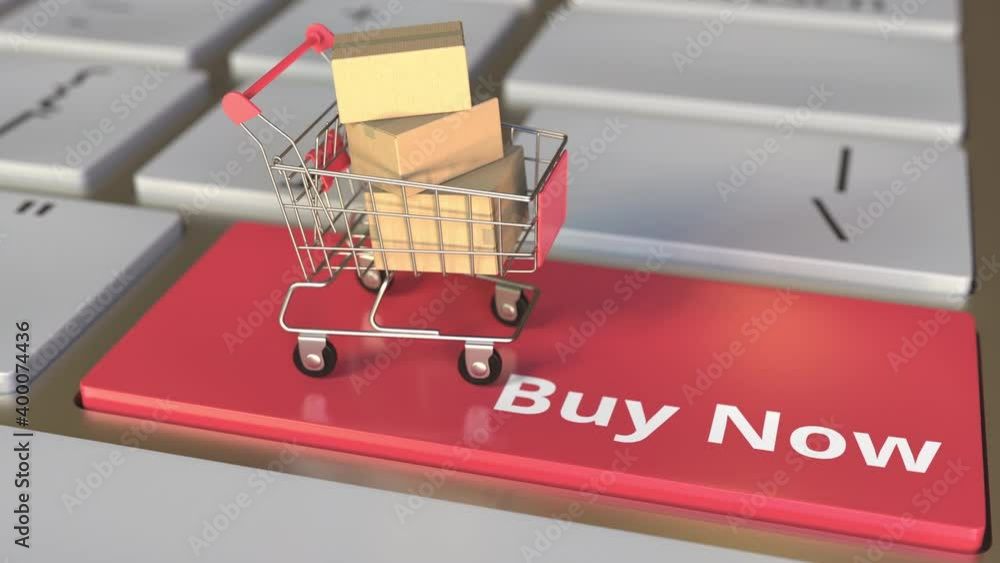 Poster buy now text on computer keyboard and boxes in small shopping cart. electronic business conceptual 3