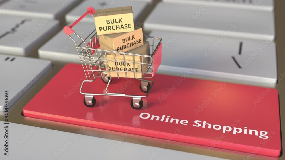 Aufkleber online shopping text on computer keyboard and bulk purchase boxes in small shopping cart. electronic
