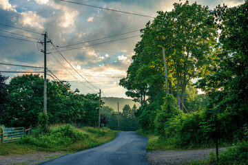 Hazy sunset over country road in the mountains upstate NY