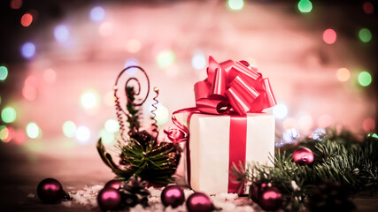 green fir branches on the wooden floor with gifts with Christmas