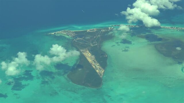 Flying over The Bahamas. Beautiful ocean colors. Actual aerial footage.
