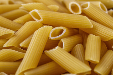 Macaroni, pasta, made by durum wheat.Pasta background. Testure for design.