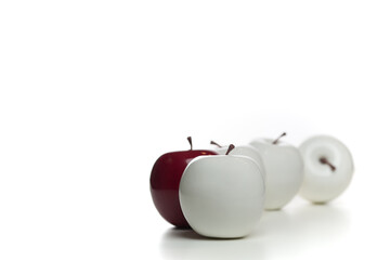 Colored apples in white and red with white background