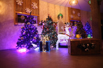 Christmas tree and gift boxes in the cozy living room