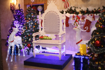 Christmas tree and chair for Santa Claus in a cozy living room