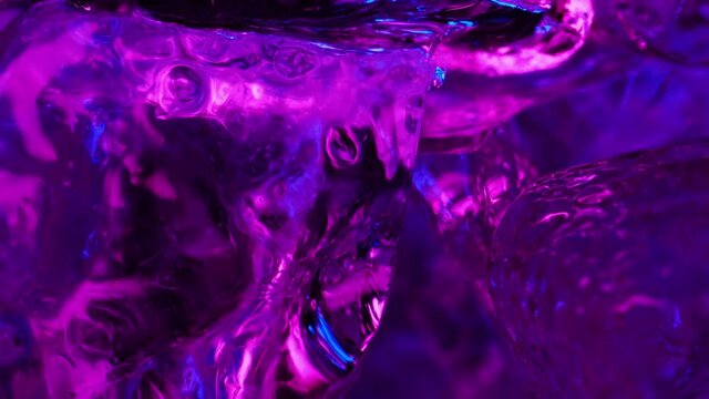 ice cubes with blue and pink highlight. beautiful abstract wallpaper with neon lights