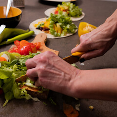 woman hands cutting vegetables