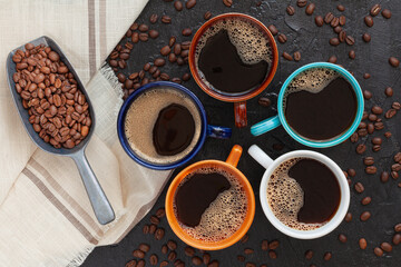 coffee cup assortment top view collection, on rustic surface with coffee beans spoon and napkin