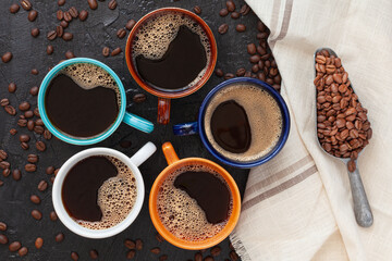 coffee cup assortment top view collection, on rustic surface with coffee beans spoon and napkin